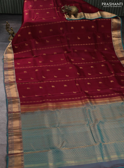 Kanchipuram silk saree deep maroon and dual shade of teal green with allover zari woven buttas and rich zari woven border