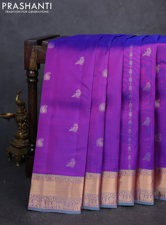 Kanchipuram silk saree purple and dual shade of teal green with allover zari woven buttas and rich zari woven border