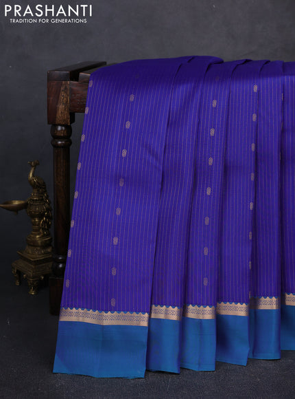 Kanchipuram silk saree royal blue and peacock blue with allover zari woven stripes & buttas and zari woven simple border