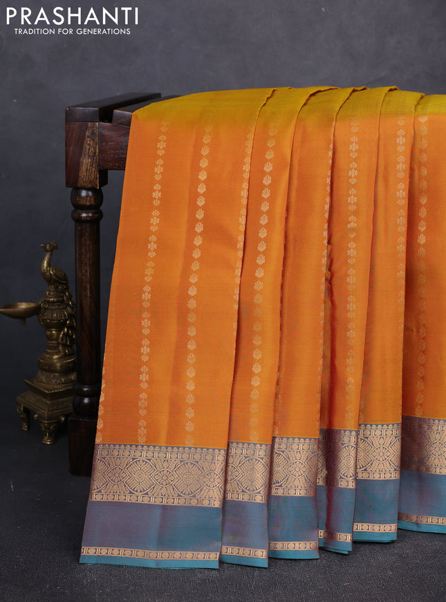 Kanchipuram silk saree mustard yellow and peacock green with allover zari woven buttas and zari woven simple border
