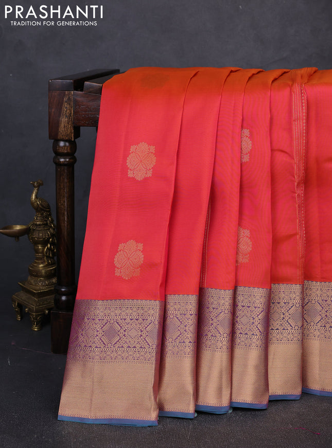 Kanchipuram silk saree dual shade of pinkish orange and dual shade of pinkish teal green with allover zari woven stripes & buttas and long rich zari woven border