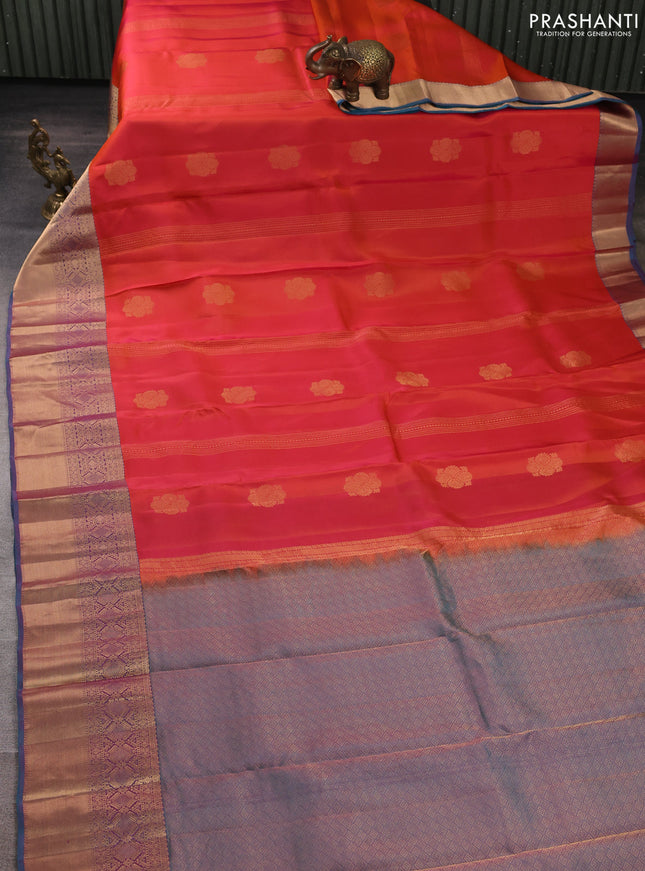 Kanchipuram silk saree dual shade of pinkish orange and dual shade of pinkish teal green with allover zari woven stripes & buttas and long rich zari woven border