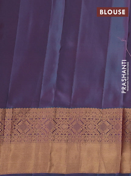 Kanchipuram silk saree dual shade of pinkish orange and dual shade of pinkish teal green with allover zari woven stripes & buttas and long rich zari woven border