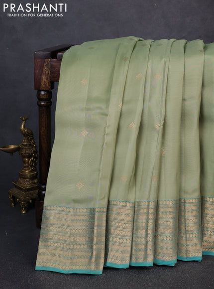 Kanchipuram silk saree pastel green and teal green with zari woven buttas and long zari woven border