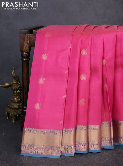 Kanchipuram silk saree pink and peacock green with allover zari stripes & buttas and rich zari woven border