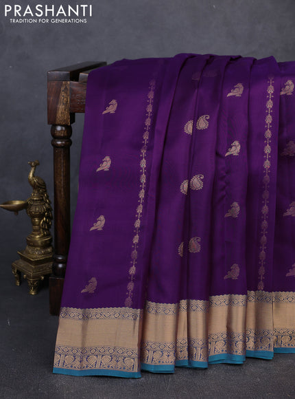 Kanchipuram silk saree purple and peacock green with allover zari stripes & buttas and rich zari woven border