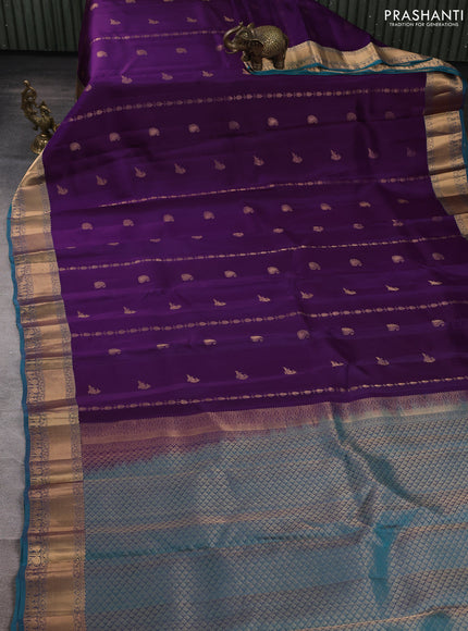 Kanchipuram silk saree purple and peacock green with allover zari stripes & buttas and rich zari woven border