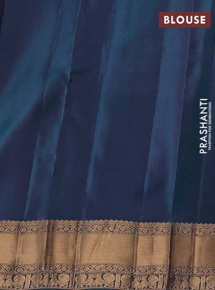 Kanchipuram silk saree purple and peacock green with allover zari stripes & buttas and rich zari woven border