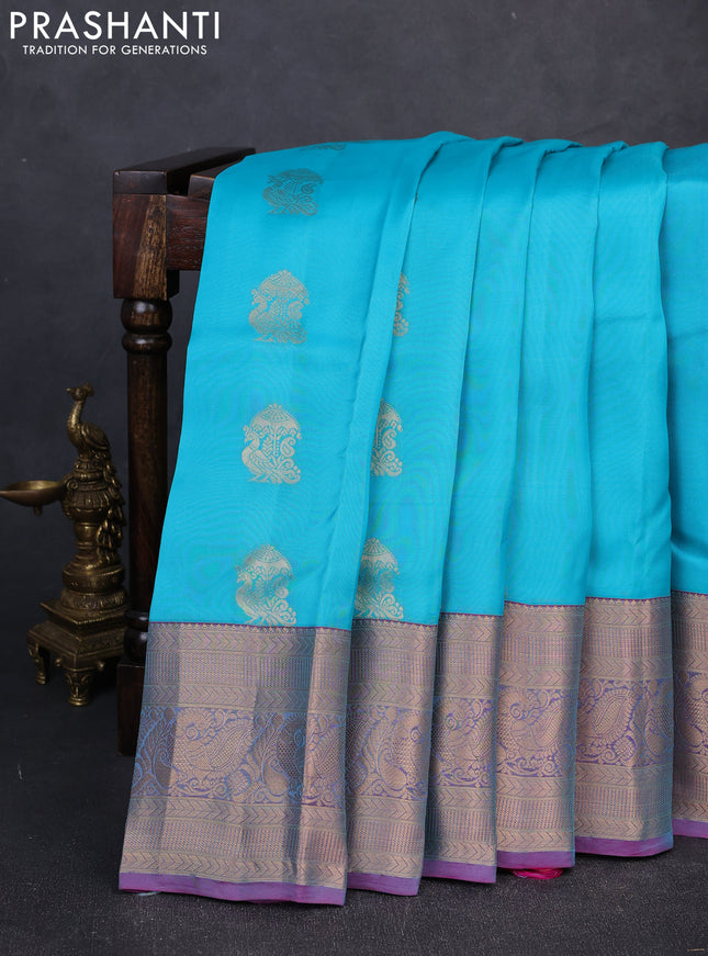 Kanchipuram silk saree teal blue and dual shade of purple with peacock zari woven buttas and long zari woven border