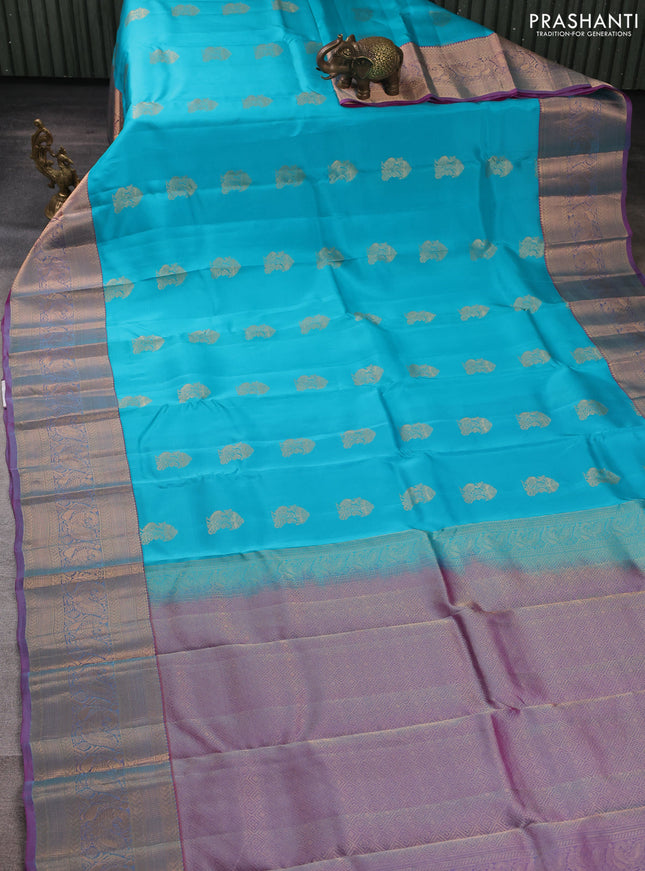 Kanchipuram silk saree teal blue and dual shade of purple with peacock zari woven buttas and long zari woven border