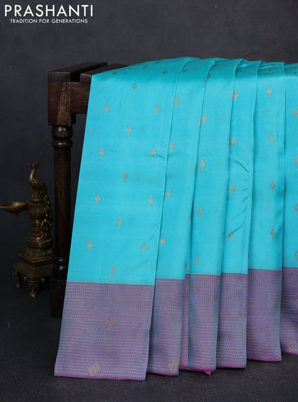 Kanchipuram silk saree teal blue and dual shade of purple with allover zari woven buttas and long zari woven border