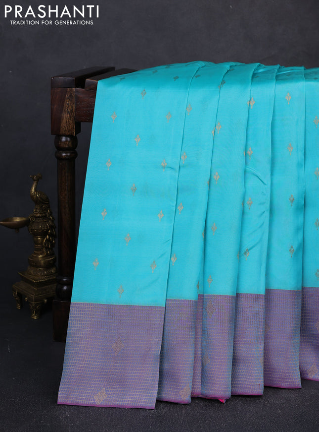 Kanchipuram silk saree teal blue and dual shade of purple with allover zari woven buttas and long zari woven border