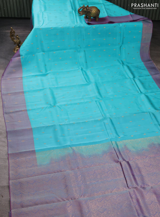 Kanchipuram silk saree teal blue and dual shade of purple with allover zari woven buttas and long zari woven border