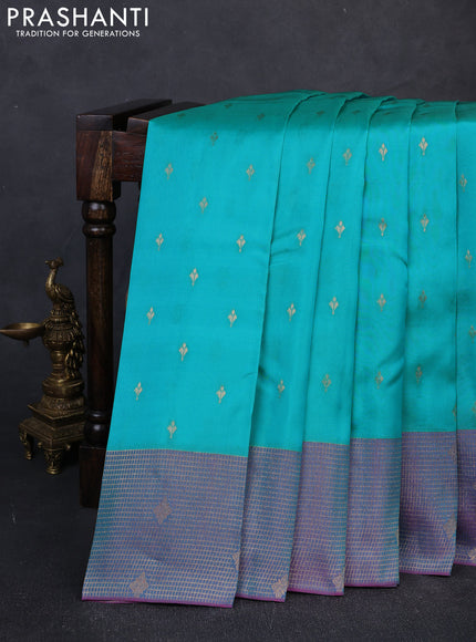Kanchipuram silk saree teal green and dual shade of purple with allover zari woven buttas and long zari woven border
