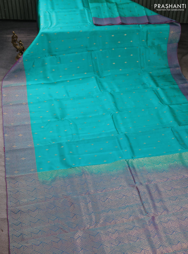 Kanchipuram silk saree teal green and dual shade of purple with allover zari woven buttas and long zari woven border