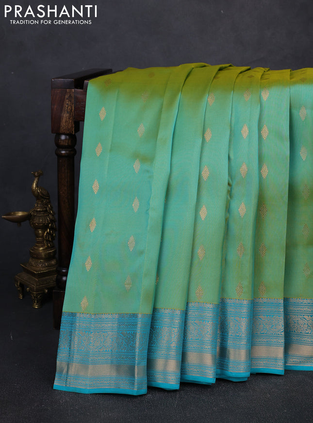 Kanchipuram silk saree dual shade of teal green and teal blue with allover zari woven buttas and zari woven border
