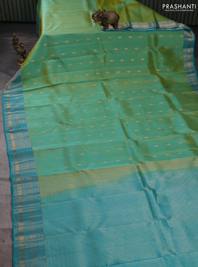 Kanchipuram silk saree dual shade of teal green and teal blue with allover zari woven buttas and zari woven border