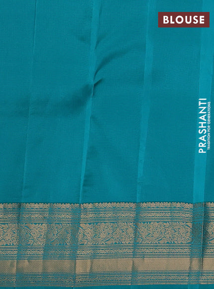 Kanchipuram silk saree dual shade of teal green and teal blue with allover zari woven buttas and zari woven border