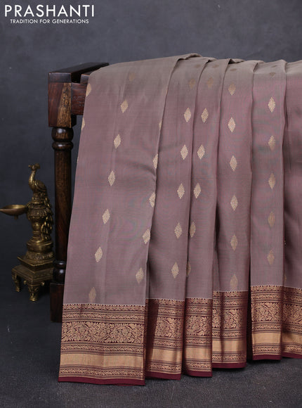 Kanchipuram silk saree brown shade and deep maroon with allover zari woven buttas and zari woven border
