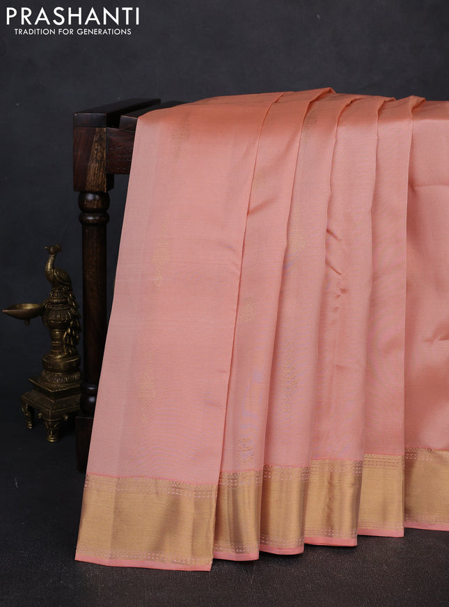 Kanchipuram silk saree peach and peacock green with allover vairosi pattern & zari buttas and rich zari woven border