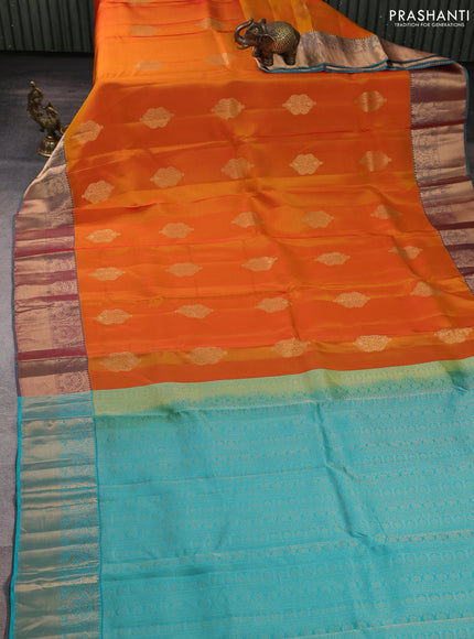 Kanchipuram silk saree sunset orange and teal green with zari woven buttas and rich zari woven border
