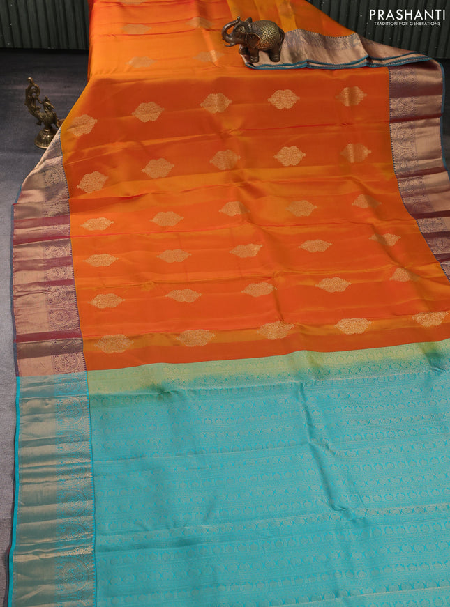 Kanchipuram silk saree sunset orange and teal green with zari woven buttas and rich zari woven border