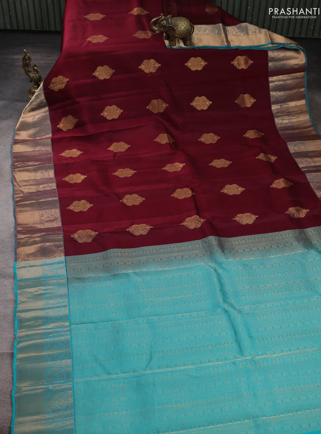 Kanchipuram silk saree deep maroon and dual shade of teal green with zari woven buttas and long rich zari woven border
