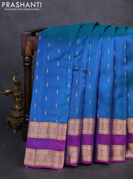 Kanchipuram silk saree peacock blue and purple with allover zari woven buttas and rettapet zari woven border