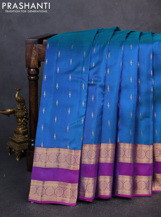 Kanchipuram silk saree peacock blue and purple with allover zari woven buttas and rettapet zari woven border
