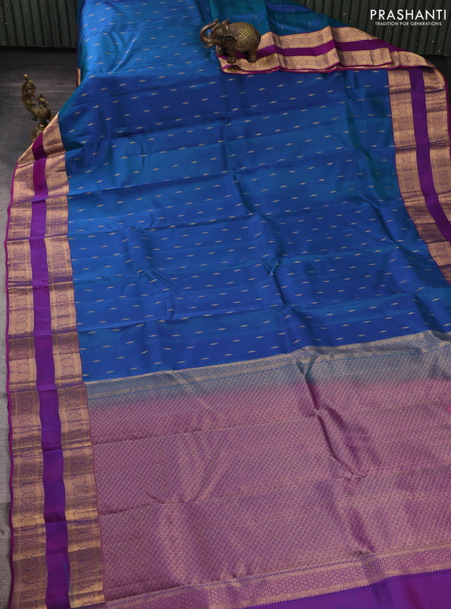 Kanchipuram silk saree peacock blue and purple with allover zari woven buttas and rettapet zari woven border