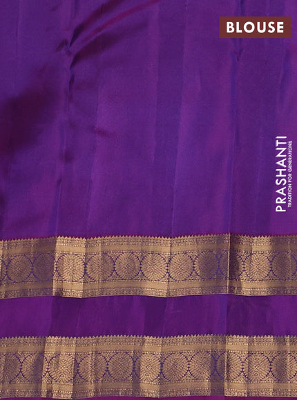 Kanchipuram silk saree peacock blue and purple with allover zari woven buttas and rettapet zari woven border