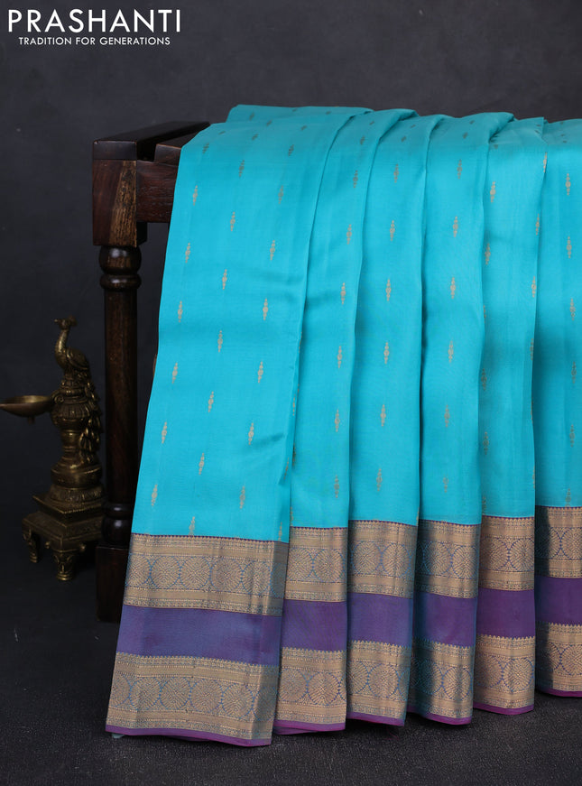 Kanchipuram silk saree teal blue and dual shade of purple with allover zari woven buttas and rettapet zari woven border