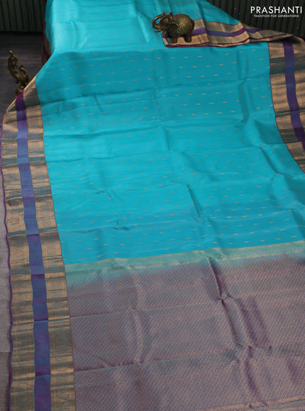 Kanchipuram silk saree teal blue and dual shade of purple with allover zari woven buttas and rettapet zari woven border