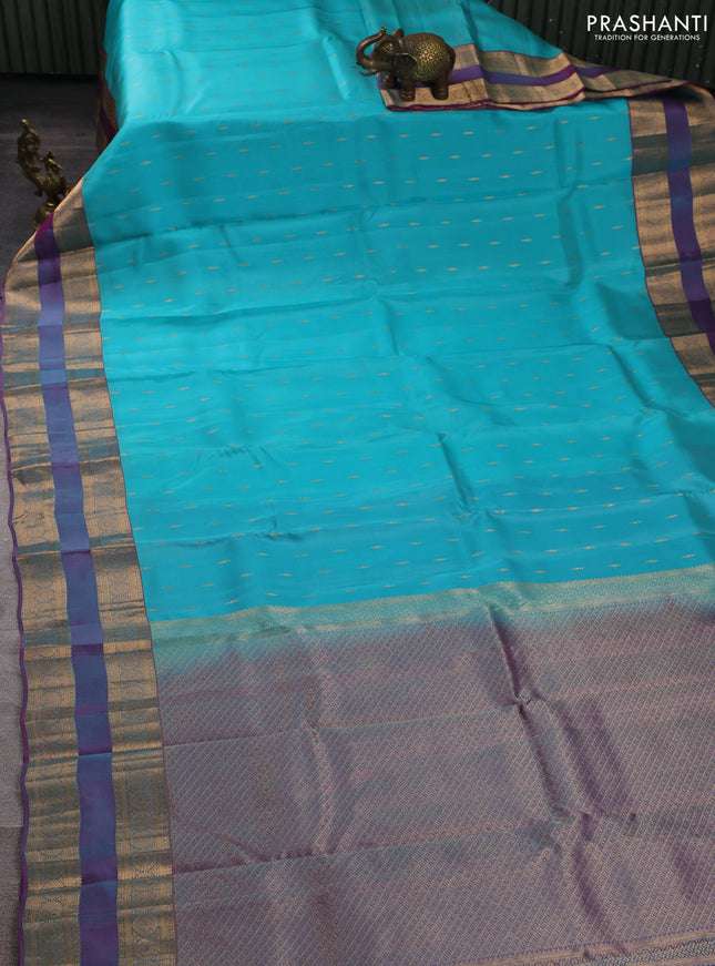 Kanchipuram silk saree teal blue and dual shade of purple with allover zari woven buttas and rettapet zari woven border