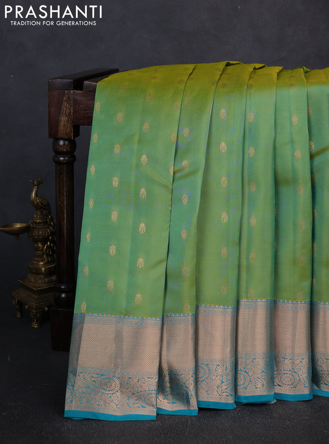 Kanchipuram silk saree dual shade of teal green and teal blue with allover zari woven buttas and long zari woven border