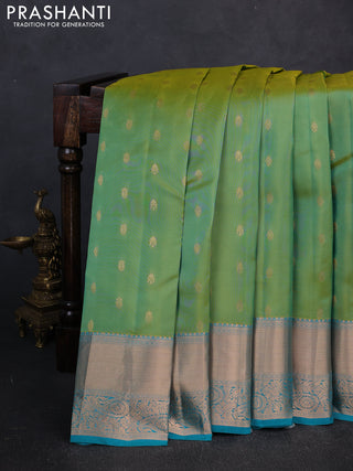 Kanchipuram silk saree dual shade of teal green and teal blue with allover zari woven buttas and long zari woven border