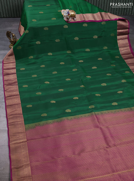 Kanchipuram silk saree green and magenta pink with paisley zari woven buttas and zari woven border
