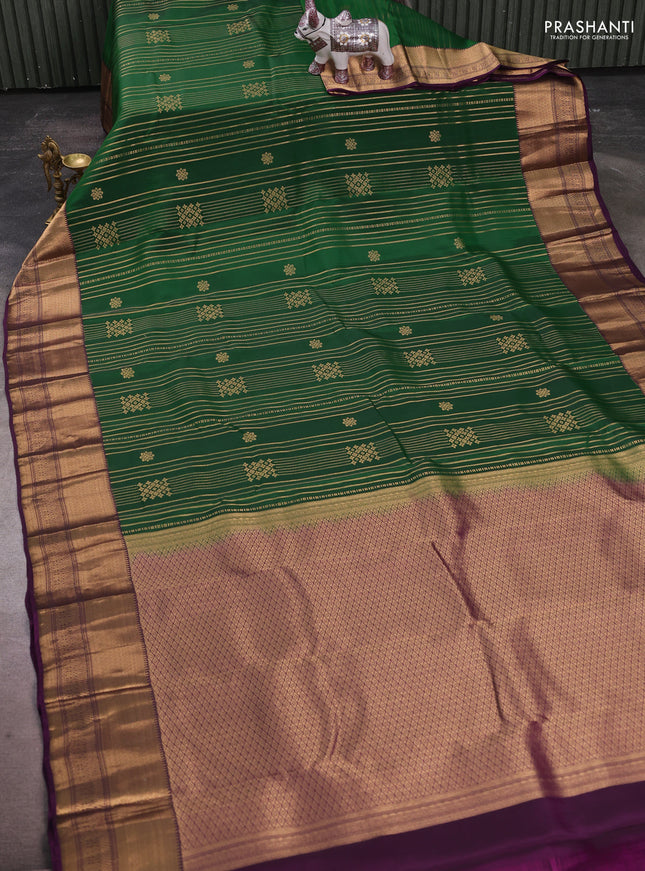 Kanchipuram silk saree green and purple with allover zari weaves & buttas and long zari woven border