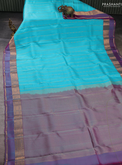 Kanchipuram silk saree teal blue and dual shade of purple with allover zari woven buttas and zari woven simple border