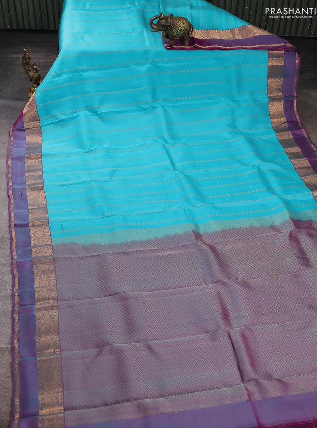 Kanchipuram silk saree teal blue and dual shade of purple with allover zari woven buttas and zari woven simple border