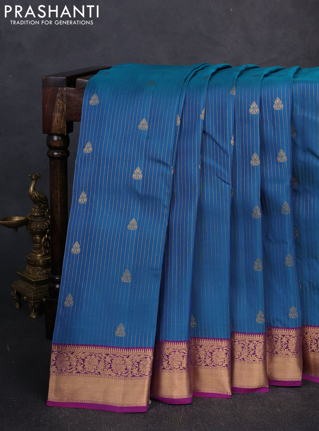 Kanchipuram silk saree teal blue and magenta pink with allover zari woven stripes & buttas and zari woven border