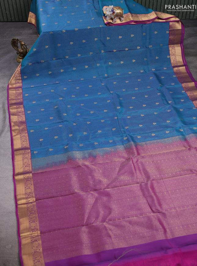 Kanchipuram silk saree teal blue and magenta pink with allover zari woven stripes & buttas and zari woven border