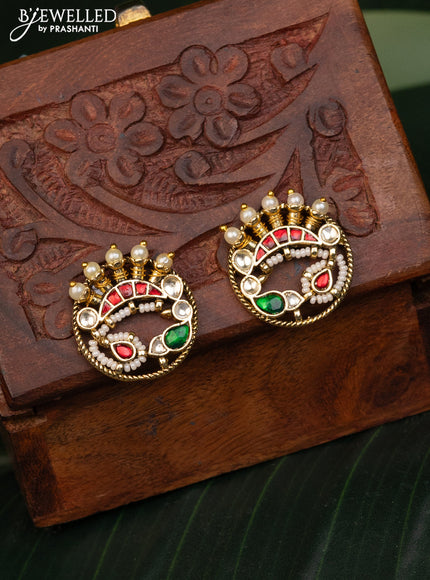 Antique earrings with pink pachi kundan stones and pearls