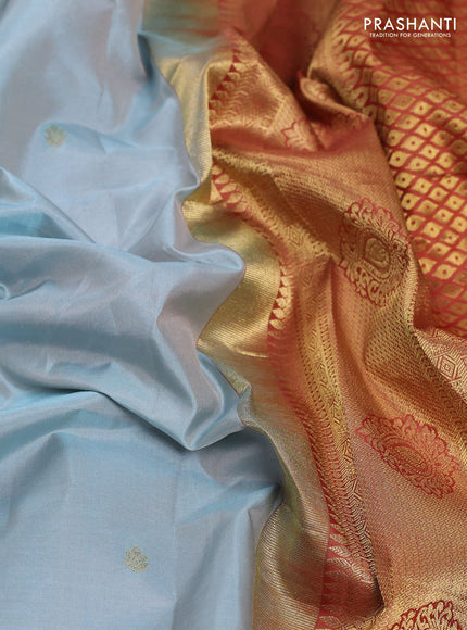 Pure gadwal silk saree pastel blue and rust shade with zari woven buttas and temple design zari woven border