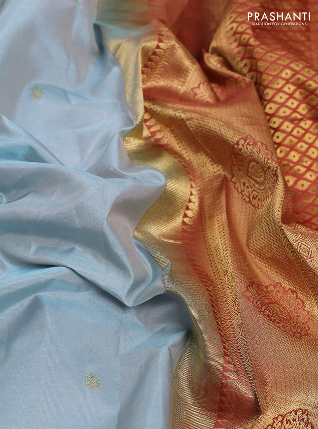 Pure gadwal silk saree pastel blue and rust shade with zari woven buttas and temple design zari woven border