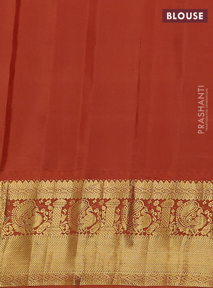 Pure gadwal silk saree pastel blue and rust shade with zari woven buttas and temple design zari woven border