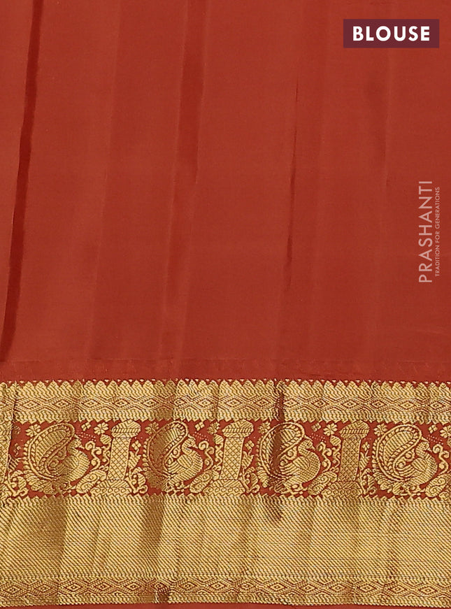 Pure gadwal silk saree pastel blue and rust shade with zari woven buttas and temple design zari woven border