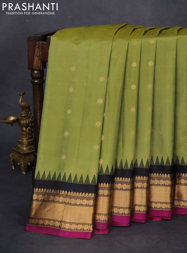 Pure gadwal silk saree light green and black with zari woven buttas and temple design zari woven border