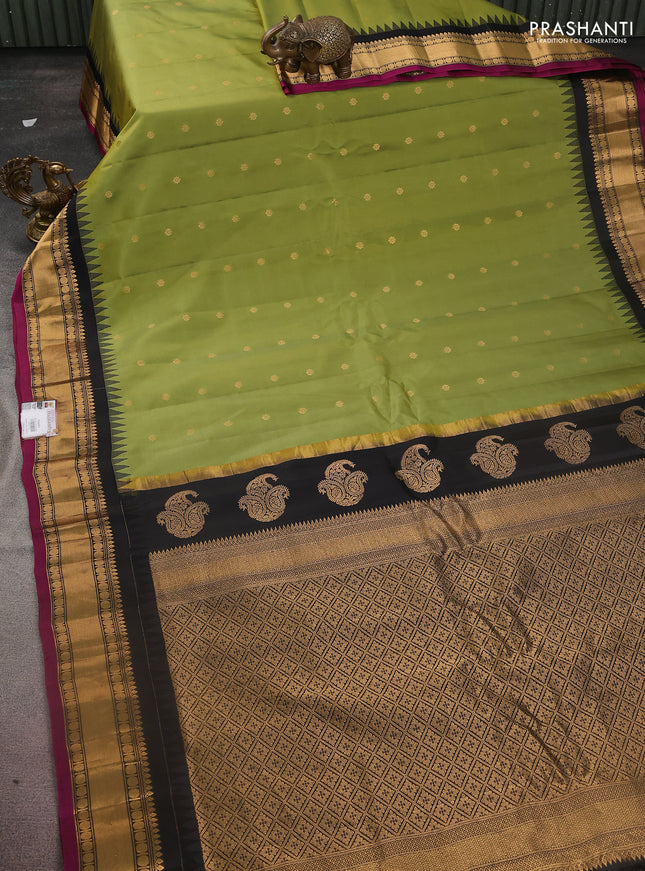 Pure gadwal silk saree light green and black with zari woven buttas and temple design zari woven border
