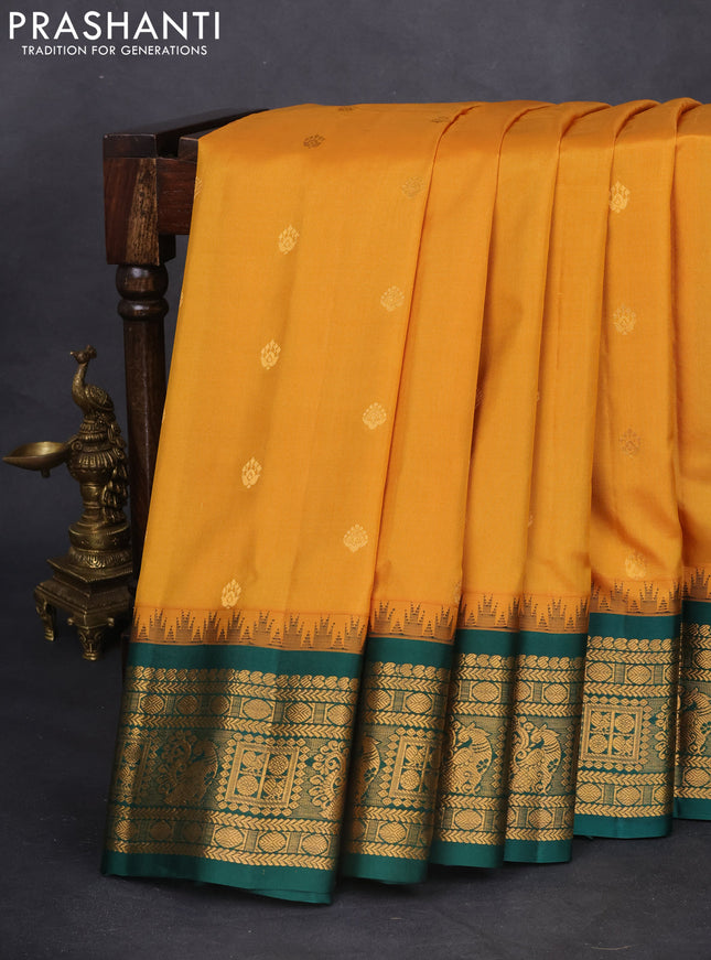 Pure gadwal silk saree mustard yellow and dark green with zari woven buttas and temple design zari woven border